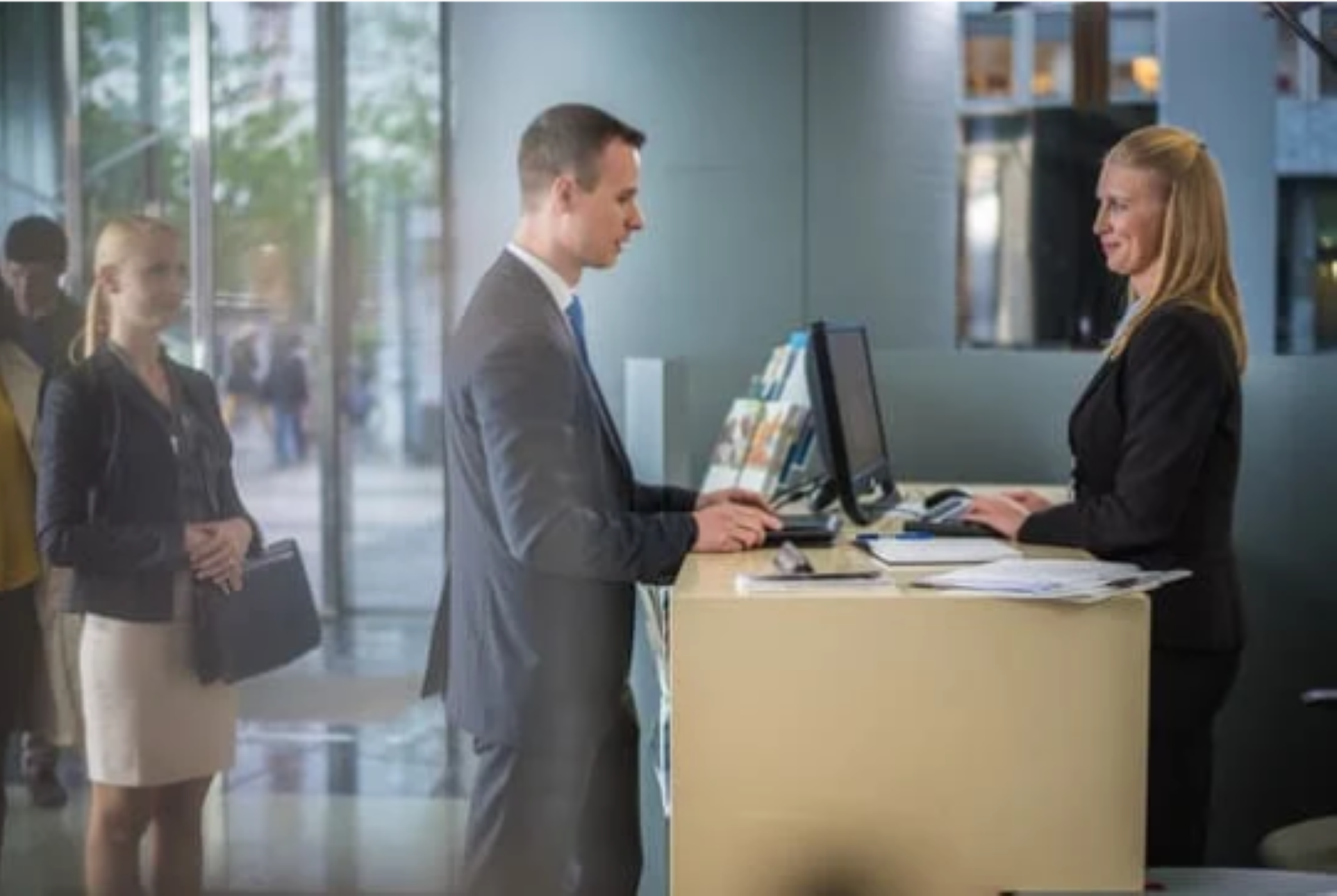 man talking to a woman at a counter