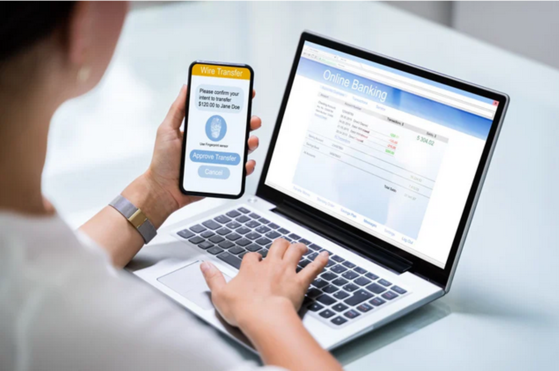 Woman with laptop and cell phone