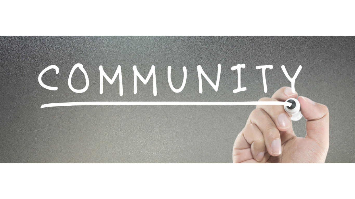 people in heart shape with hands together