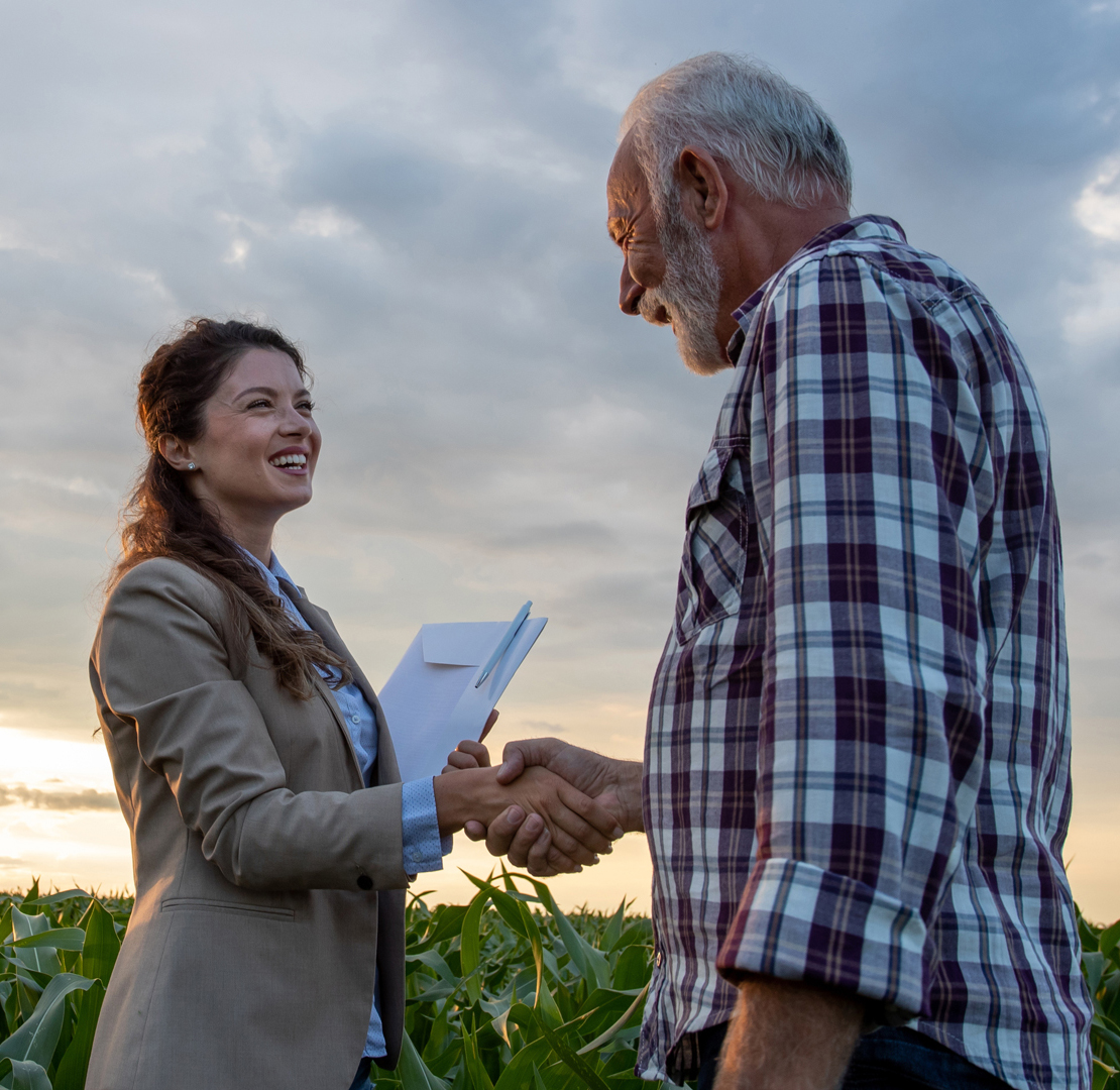 Bank woman shaking hands with farmer client